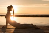 storyblocks-image-of-amazing-young-sports-lady-at-the-beach-make-yoga-exercises_rCvcHhpq-.jpg